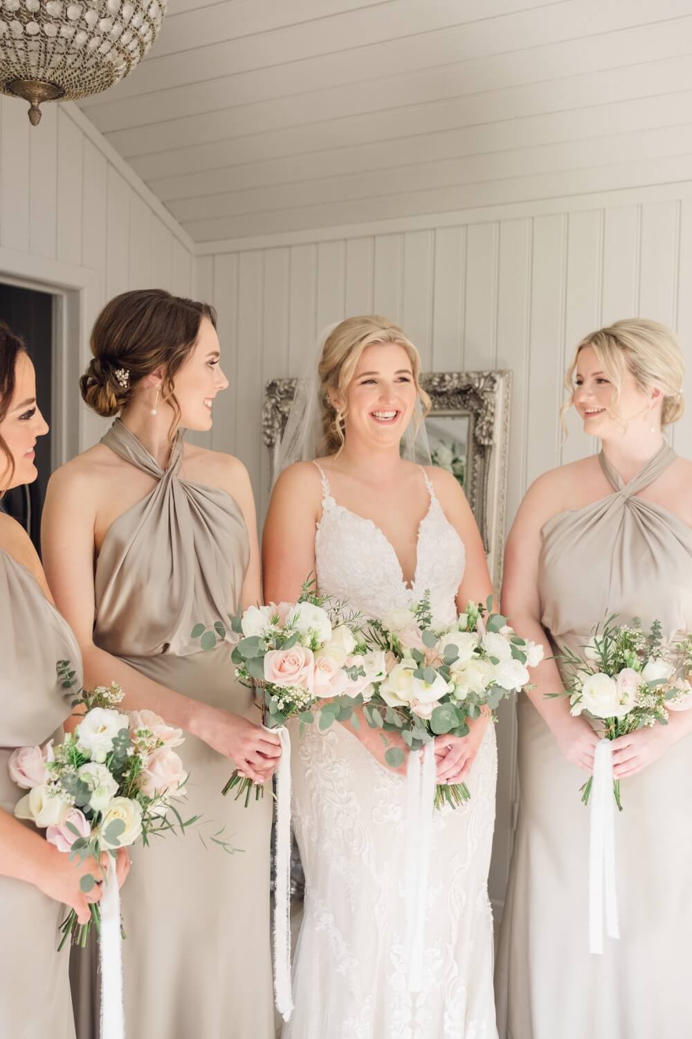 Candid moment between the bride and her bridesmaids