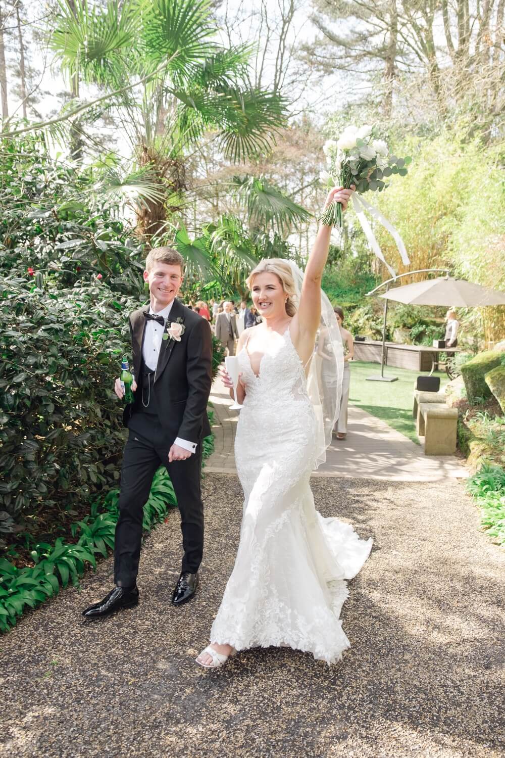 Newlyweds with a drink in hand after the ceremony