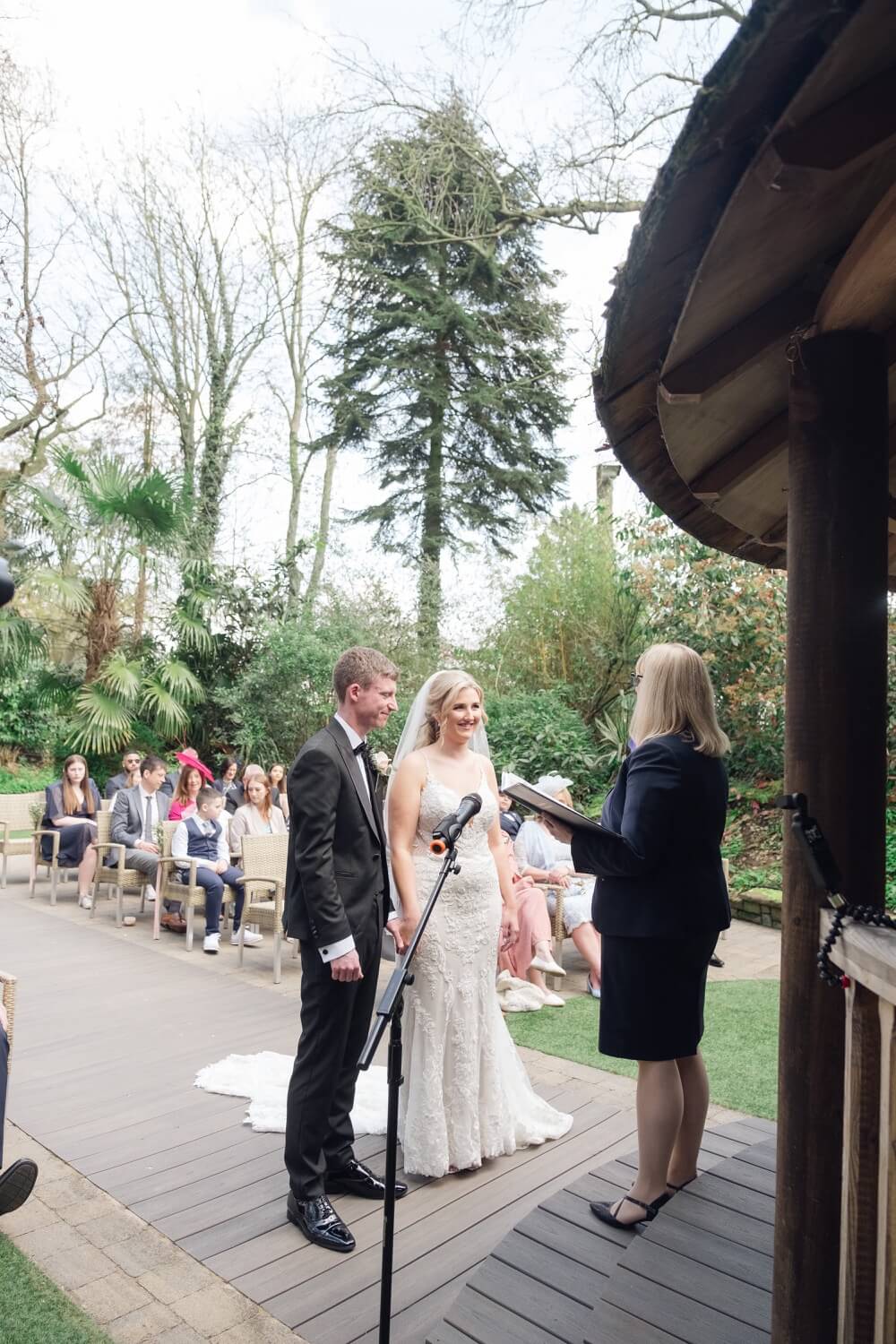 Bride and groom exchanging vows at Moxhull Hall