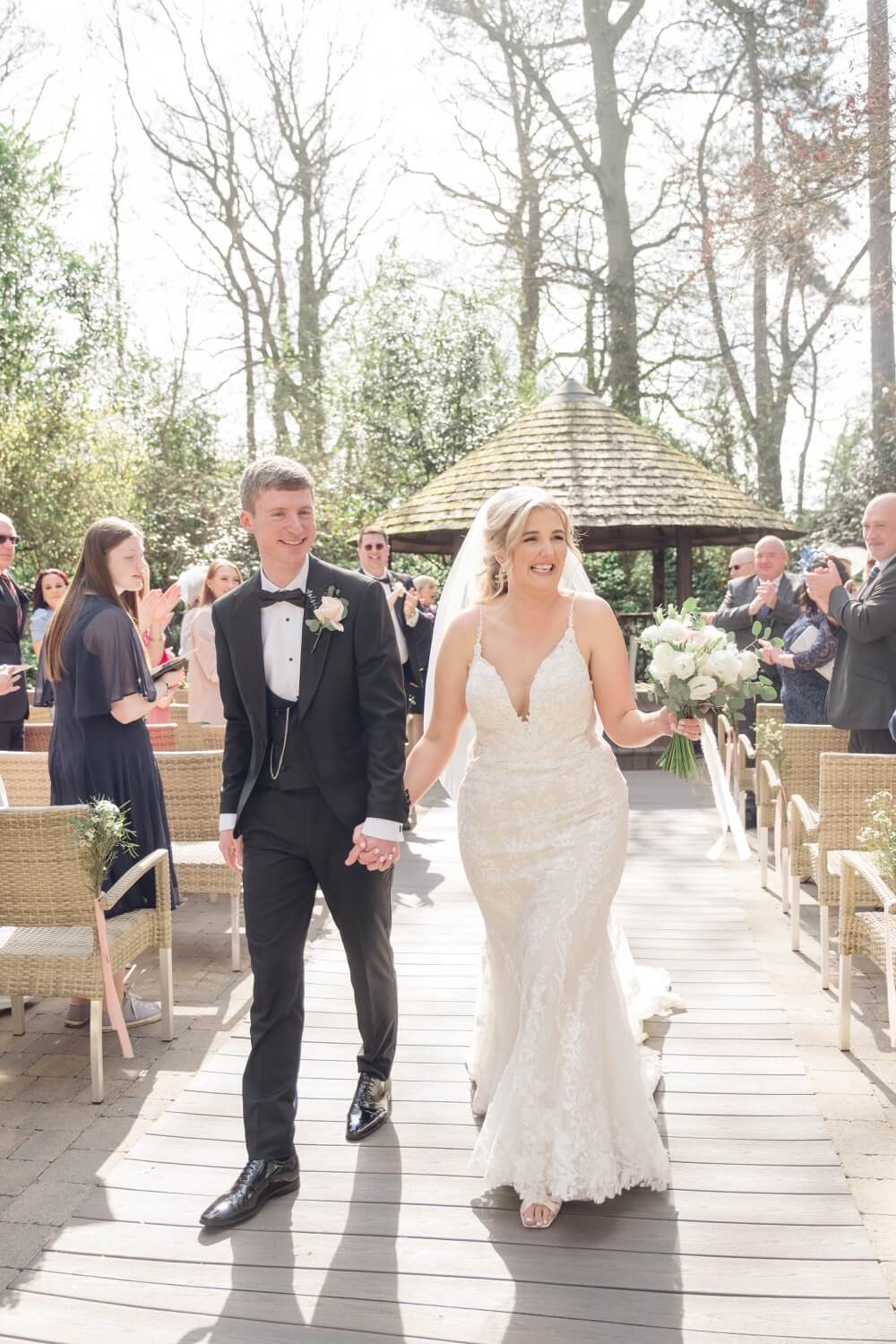 Just married, walking back down the aisle hand in hand
