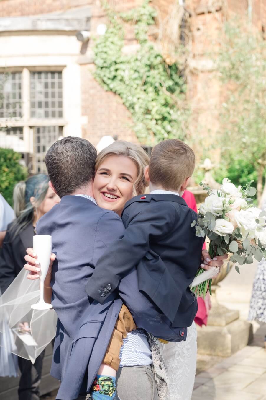 Bride with two young guests at the drinks reception