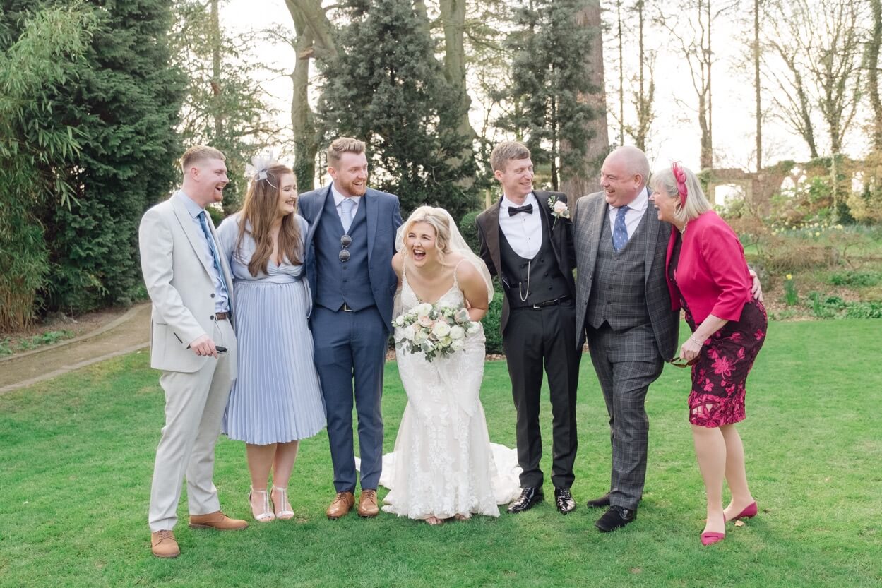 Group photo with the bride laughing