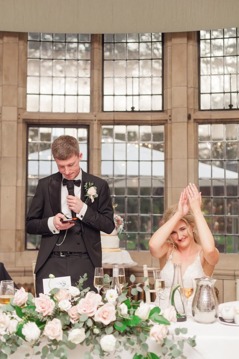 Bride clapping during the speeches