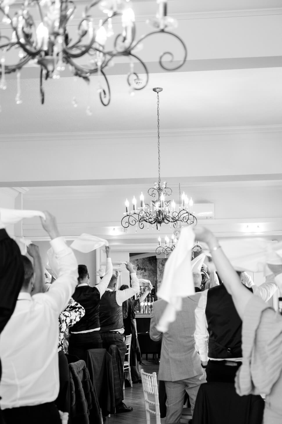 Newlyweds entering the wedding breakfast