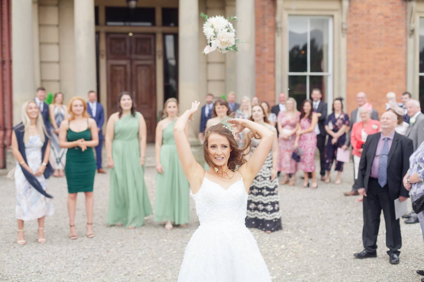 The bouquet toss at the drinks reception, Netley Hall