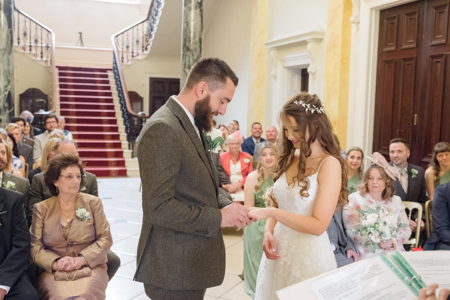 The ring going onto the bride's hand