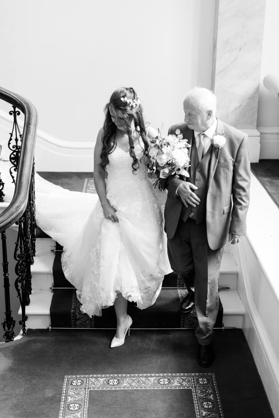 Annabelle coming down the grand staircase with her dad at Netley Hall