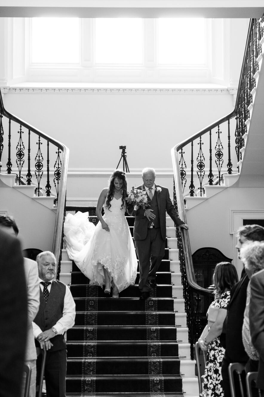The bride on the staircase at Netley Hall
