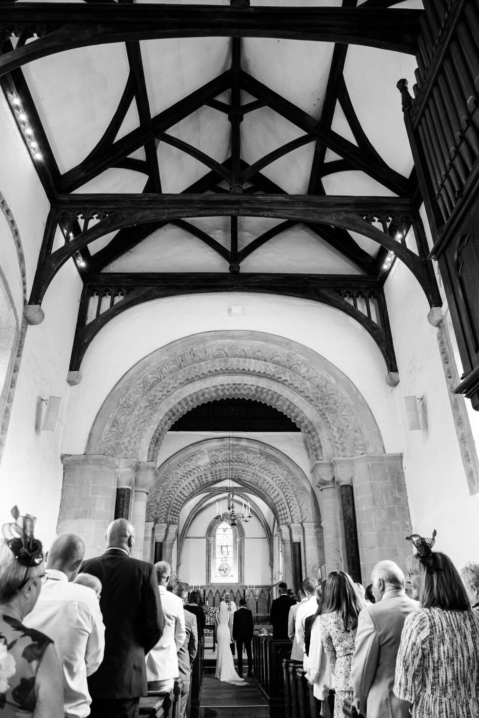 Exchanging vows during the ceremony near The Great Barn, Aynho
