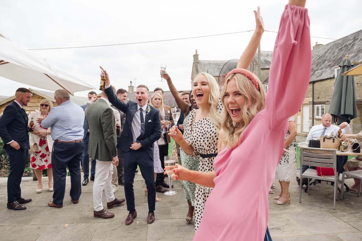 Guests dancing at the drinks reception, The Great Barn, Aynho
