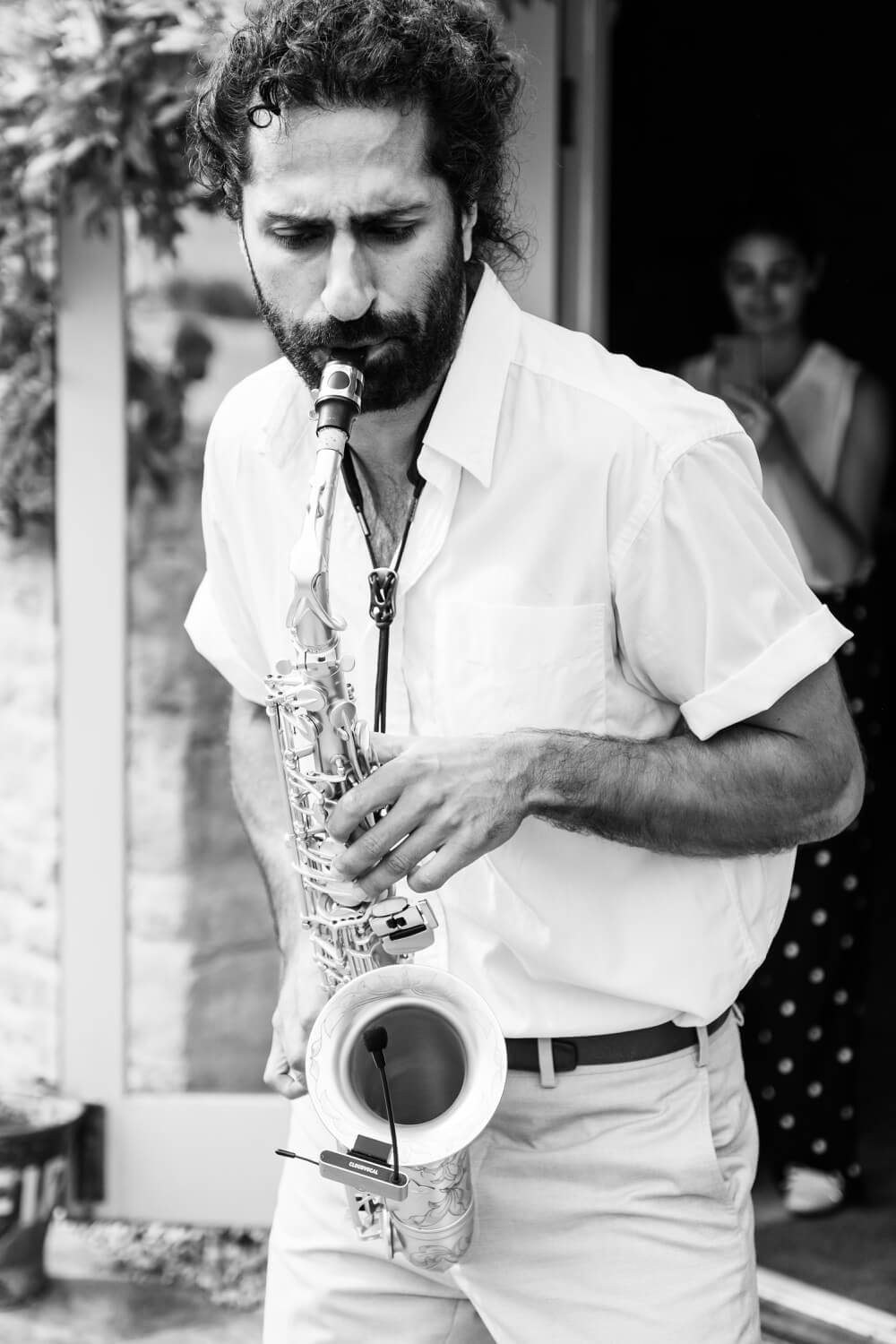 Black and white photo of the saxophonist at The Great Barn, Aynho