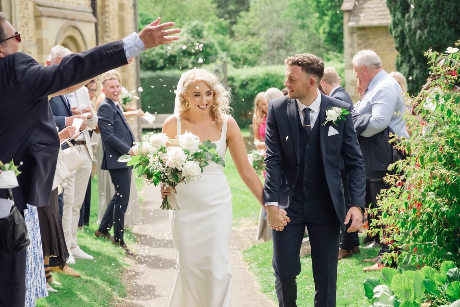 Confetti over the bride and groom, Great Barn Aynho wedding