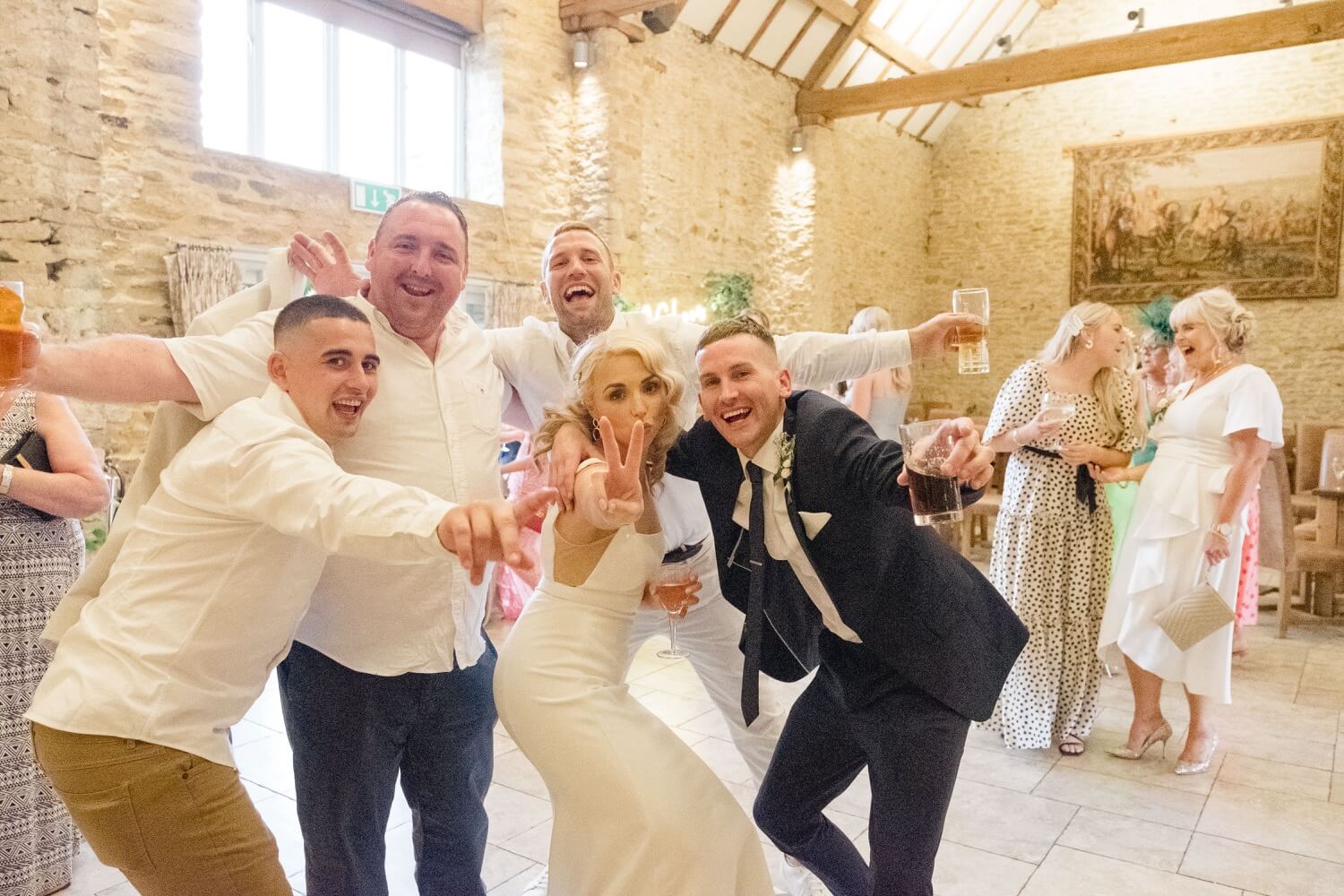 Guests dancing with the bride at The Great Barn, Aynho
