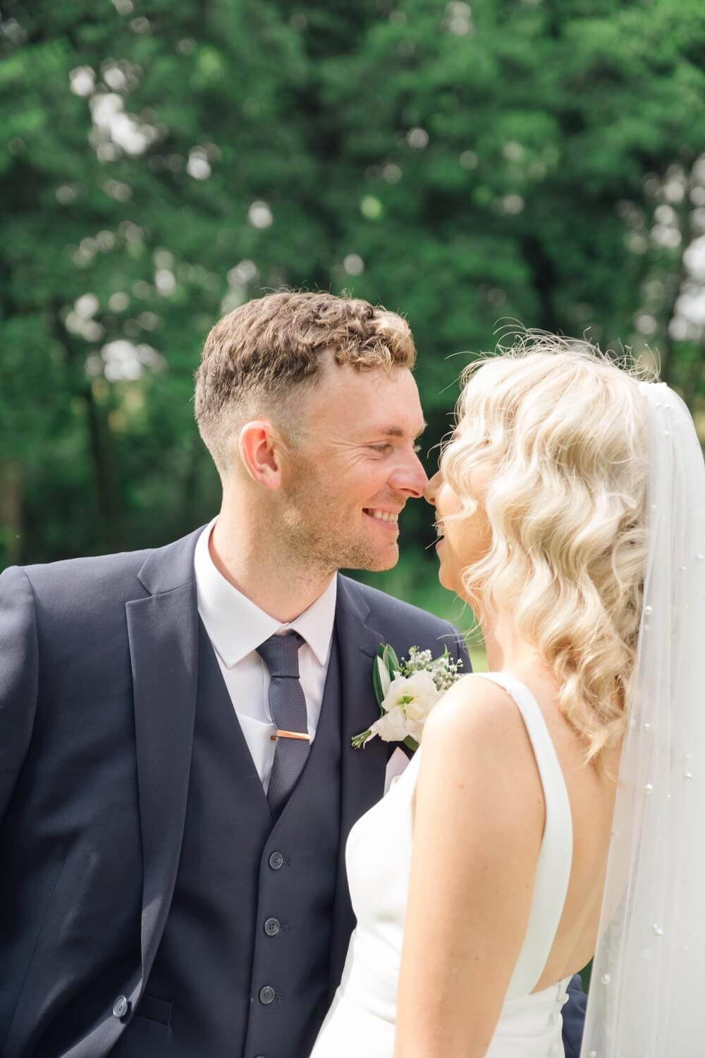 Portrait focused on the groom at The Great Barn, Aynho