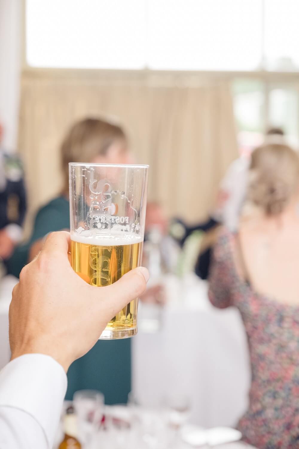 Guests cheersing during the speeches at The Great Barn, Aynho