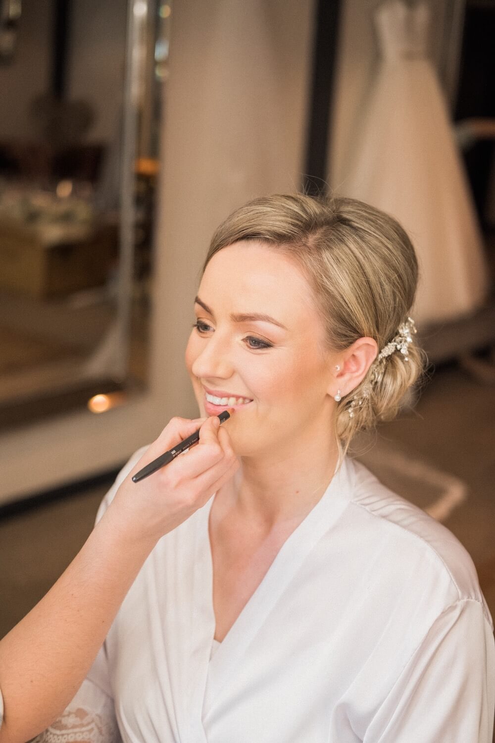 Bride having her makeup done at The Mill Barns