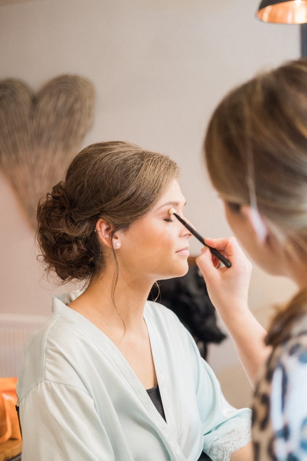 Bridesmaid having her makeup done