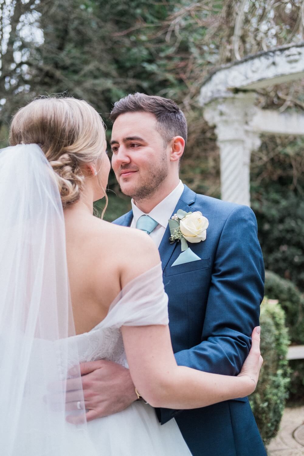 Groom with the bride during portraits