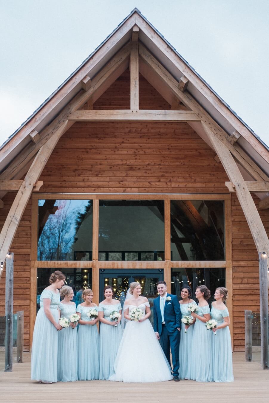 The bridal party with the groom at The Mill Barns