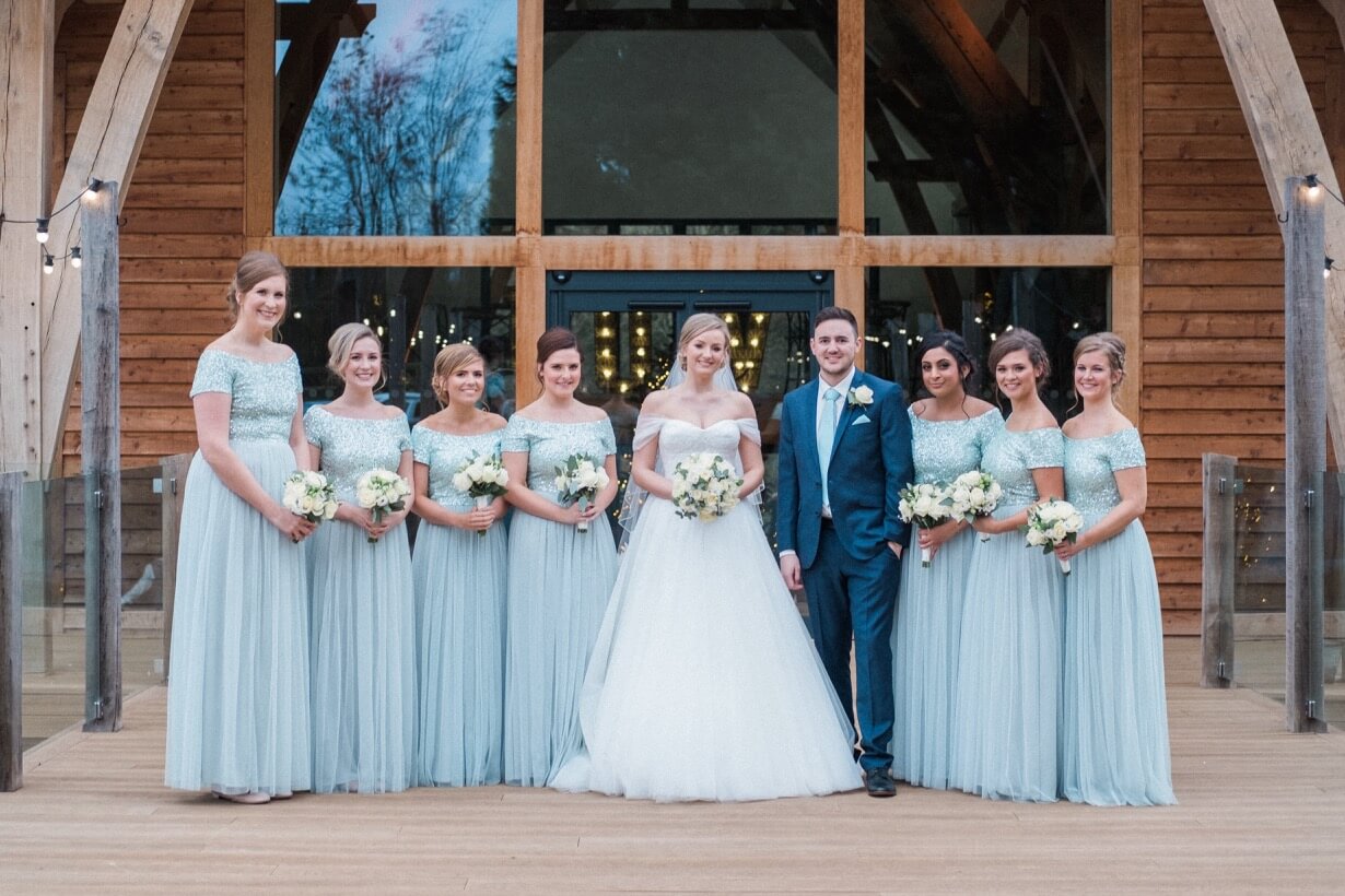 The bridal party with the groom