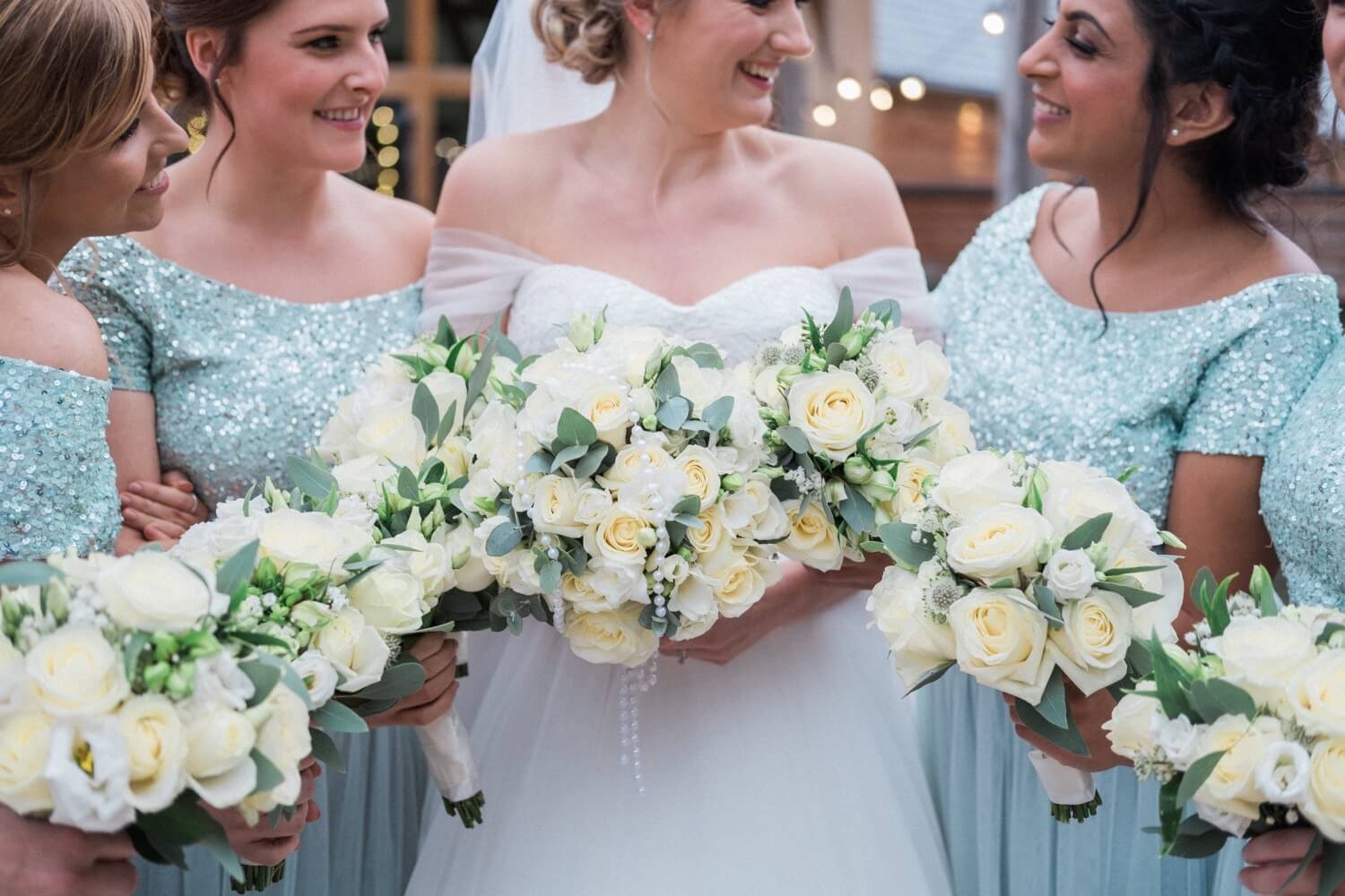 The bridal party holding their flowers