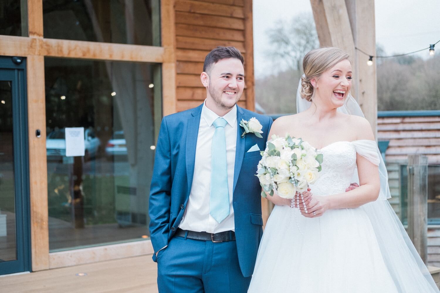 Bride and groom seeing their dog arrive at The Mill Barns