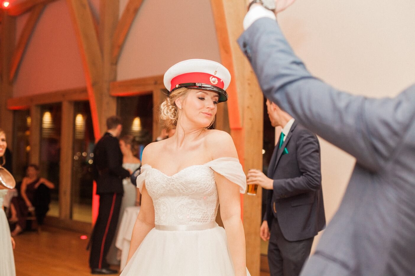 Bride dancing in a hat at The Mill Barns