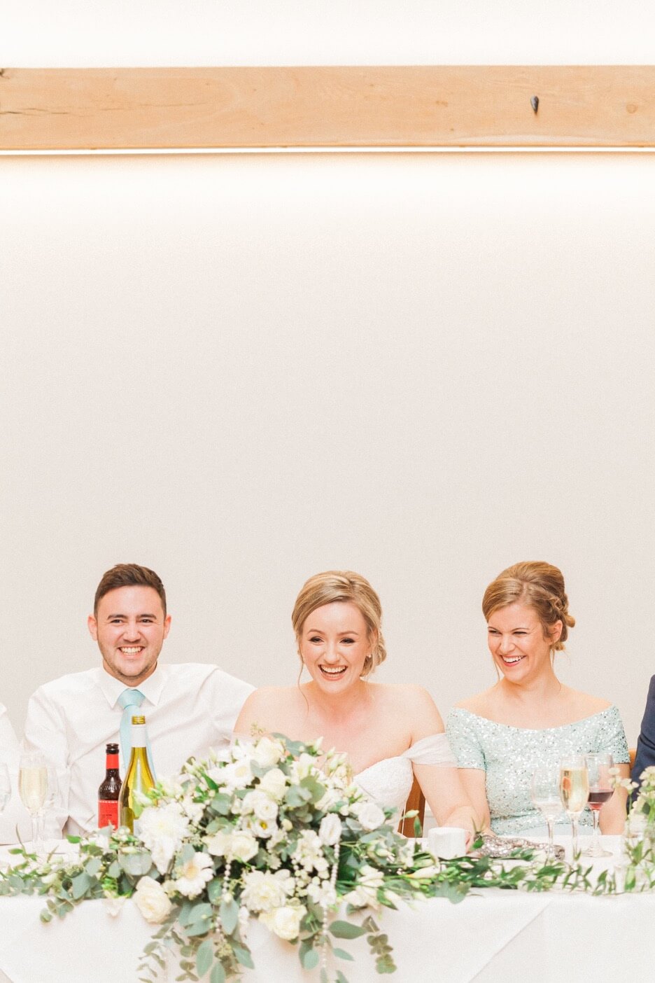 Bride, groom and bridesmaid during the speeches
