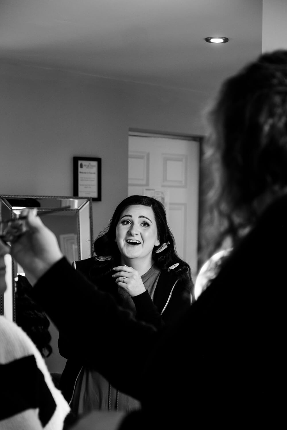 Bride laughing during preparations at The Pear Tree