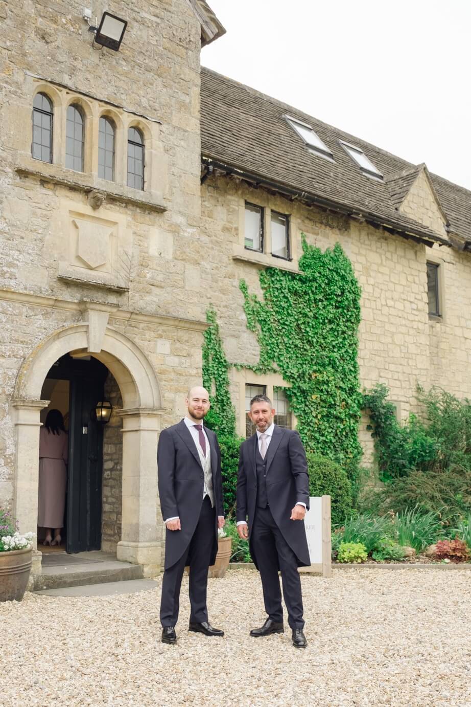 Groom and best man outside The Pear Tree
