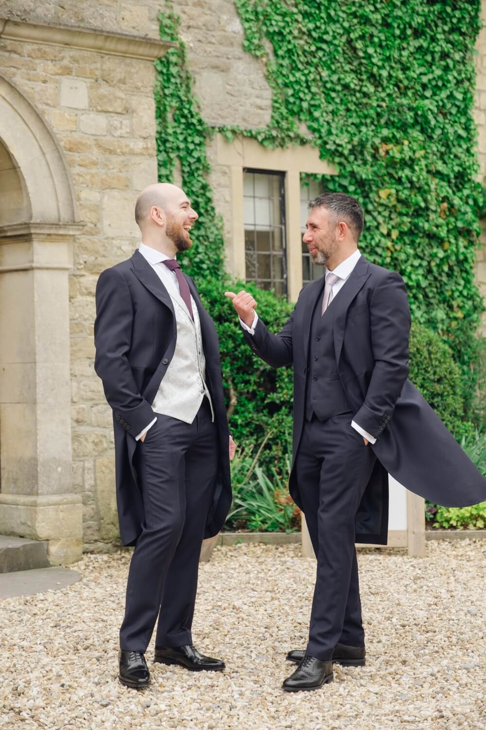 Best man and groom laughing at The Pear Tree