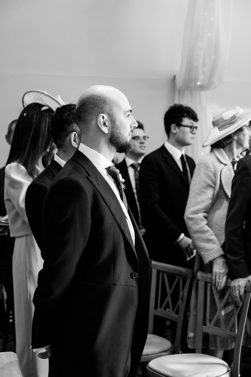 Groom waiting nervously for the bride at The Pear Tree Purton