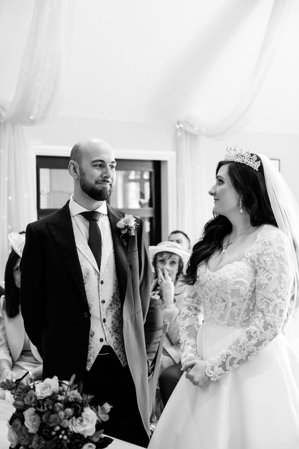 Bride arriving at the ceremony beside the groom at The Pear Tree Purton