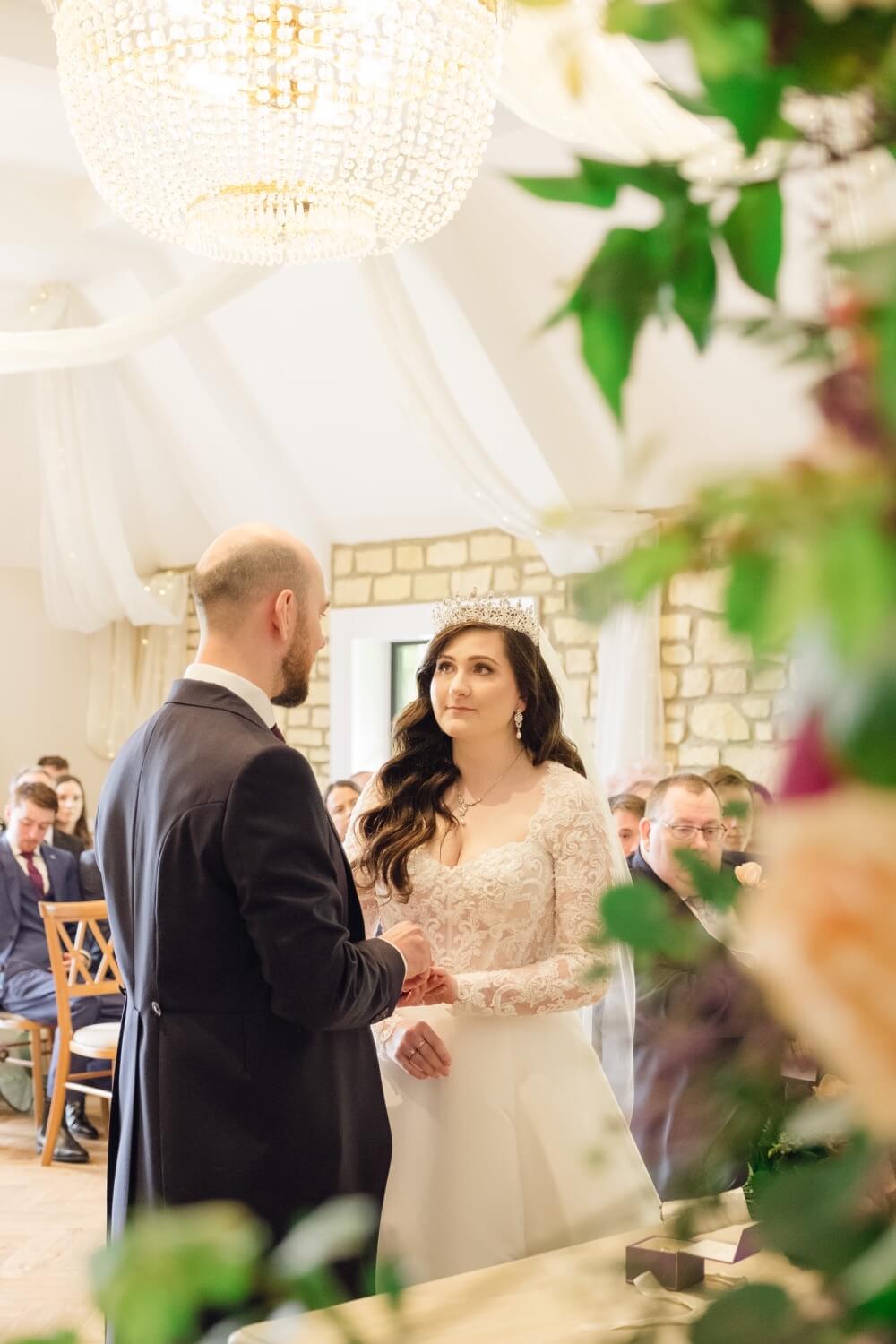 Exchanging rings during the ceremony at The Pear Tree Purton