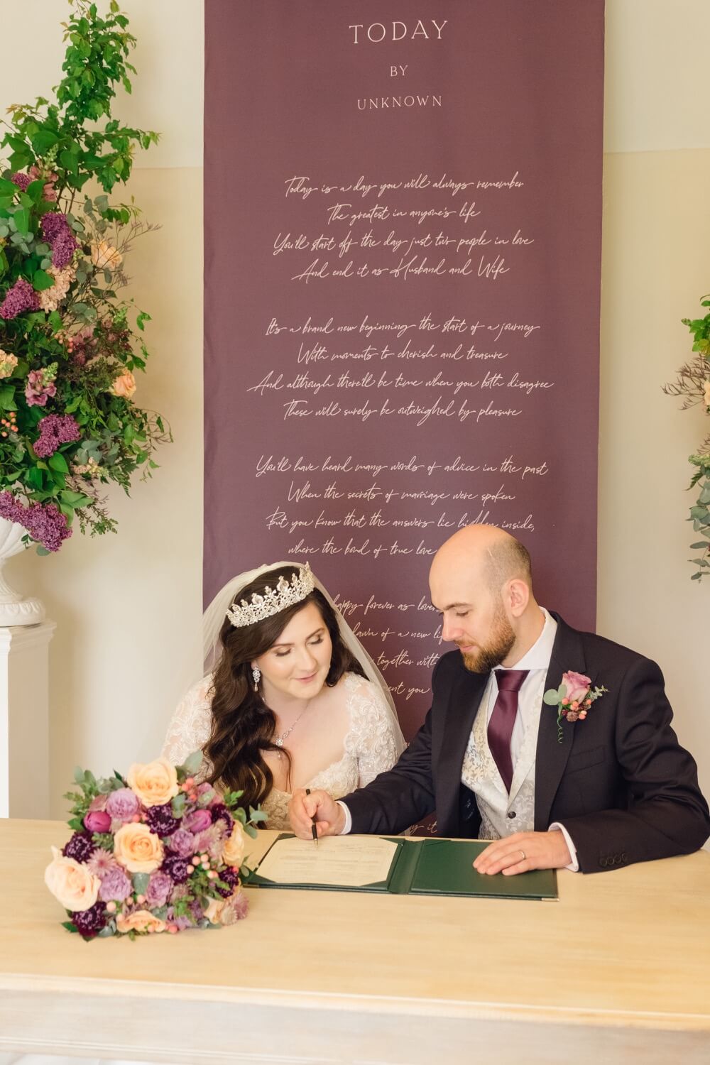 Bride and groom signing the register at The Pear Tree Purton