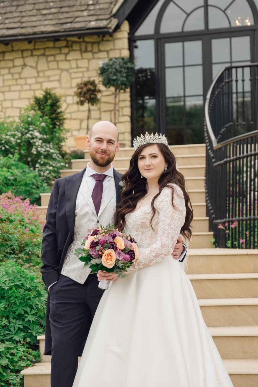 Bride and groom together in the grounds at The Pear Tree Purton