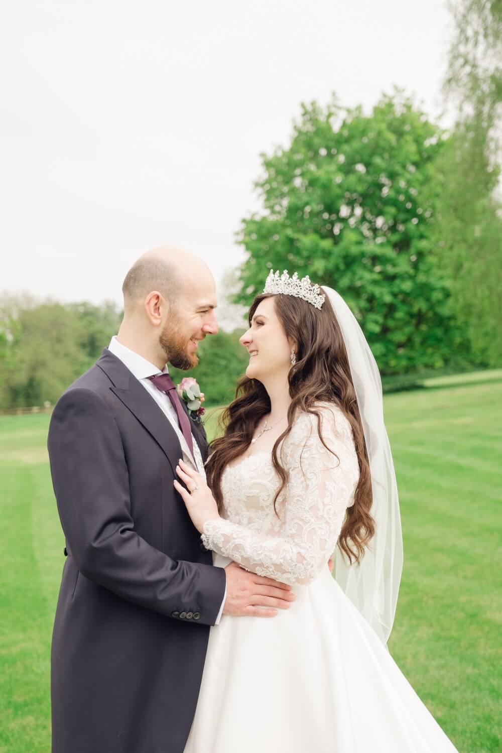 Bride and groom smiling together at The Pear Tree Purton