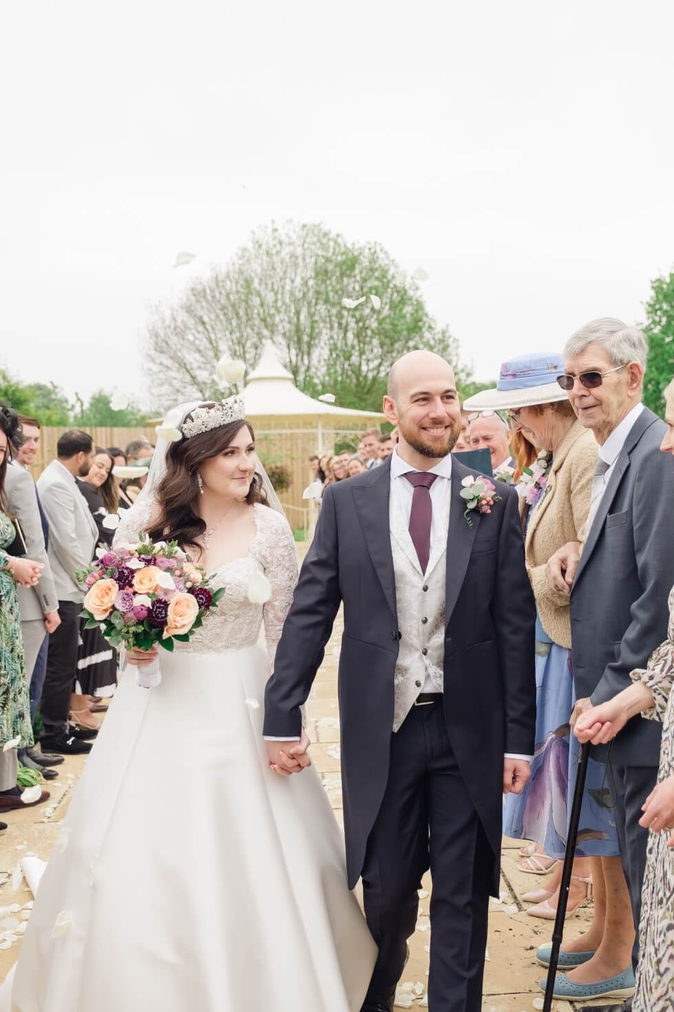 Bride and groom in the confetti at The Pear Tree Purton