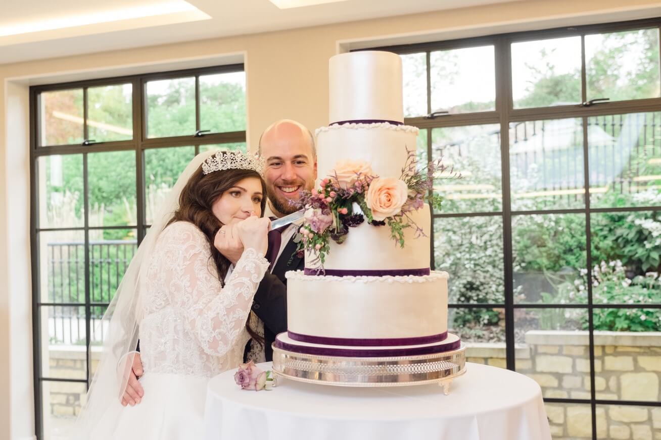 Cutting the wedding cake at The Pear Tree Purton