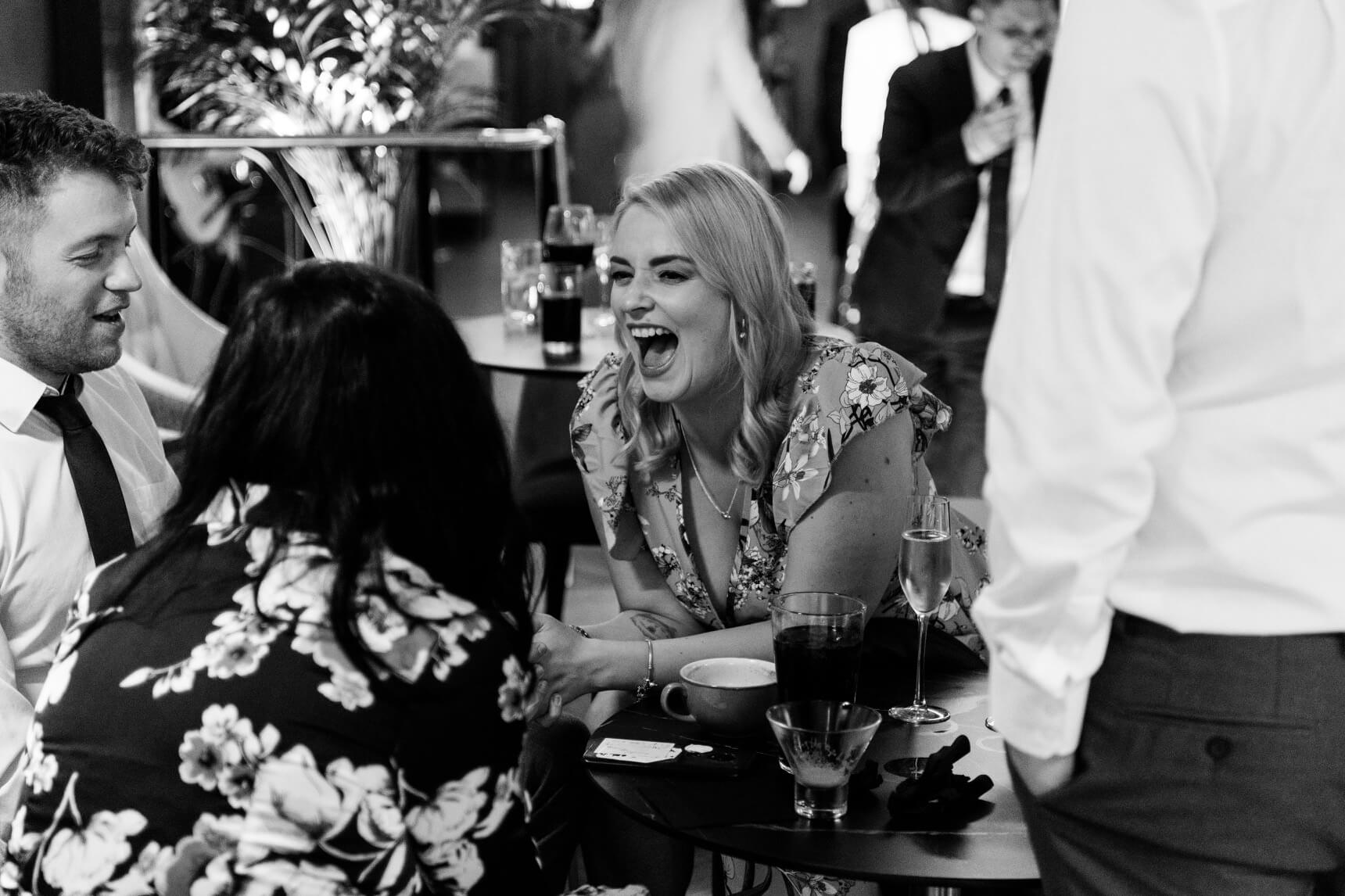 Guests laughing during the evening reception at The Pear Tree Purton