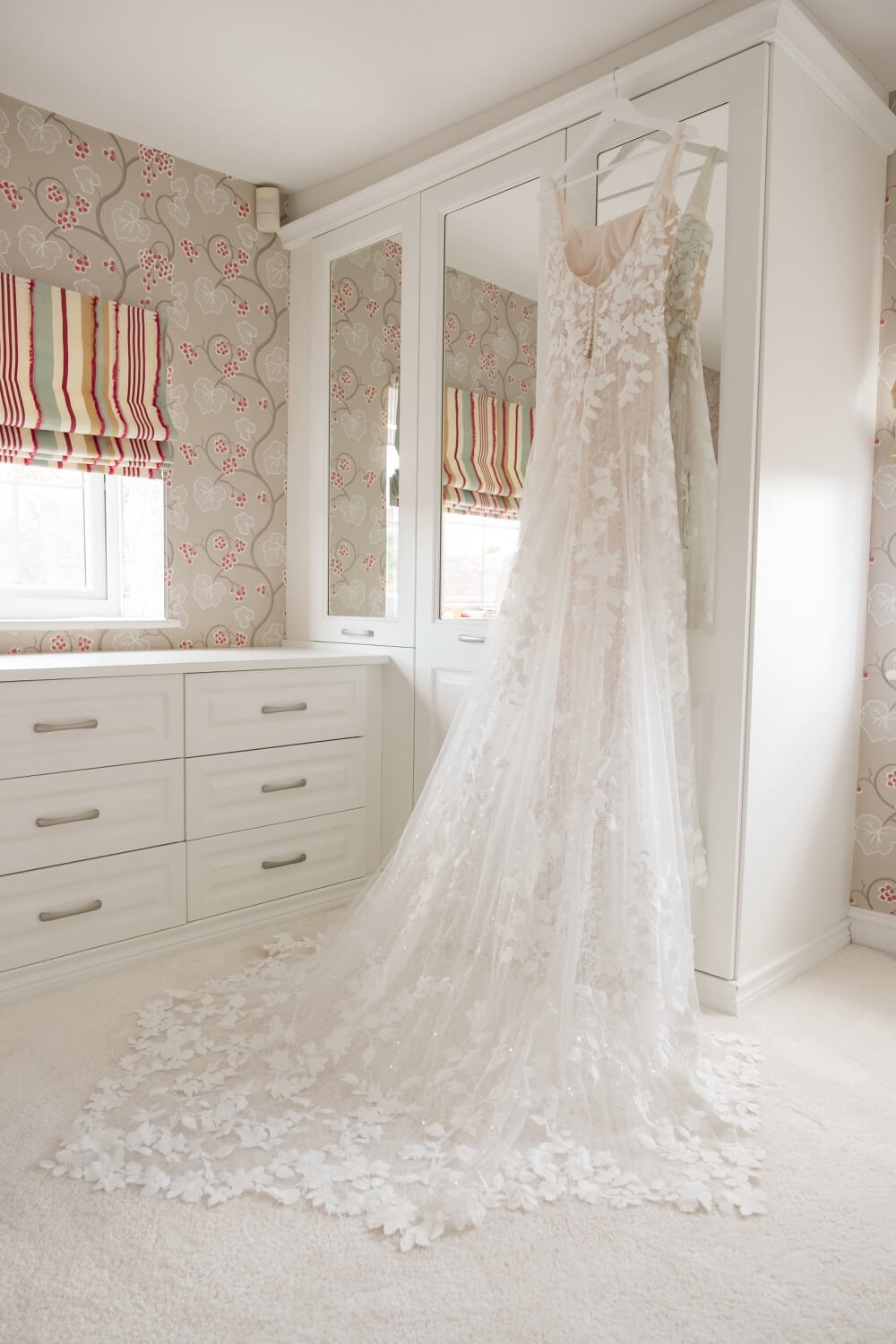 The wedding dress on its hanger at Hencote