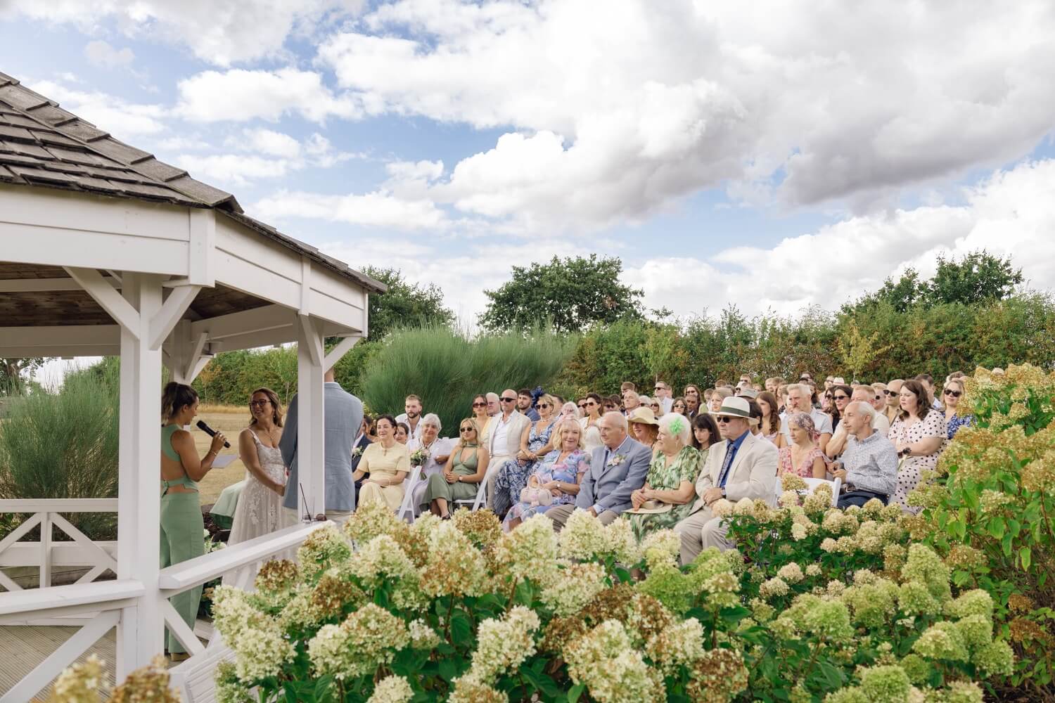 A wide view of the ceremony and guests at Hencote