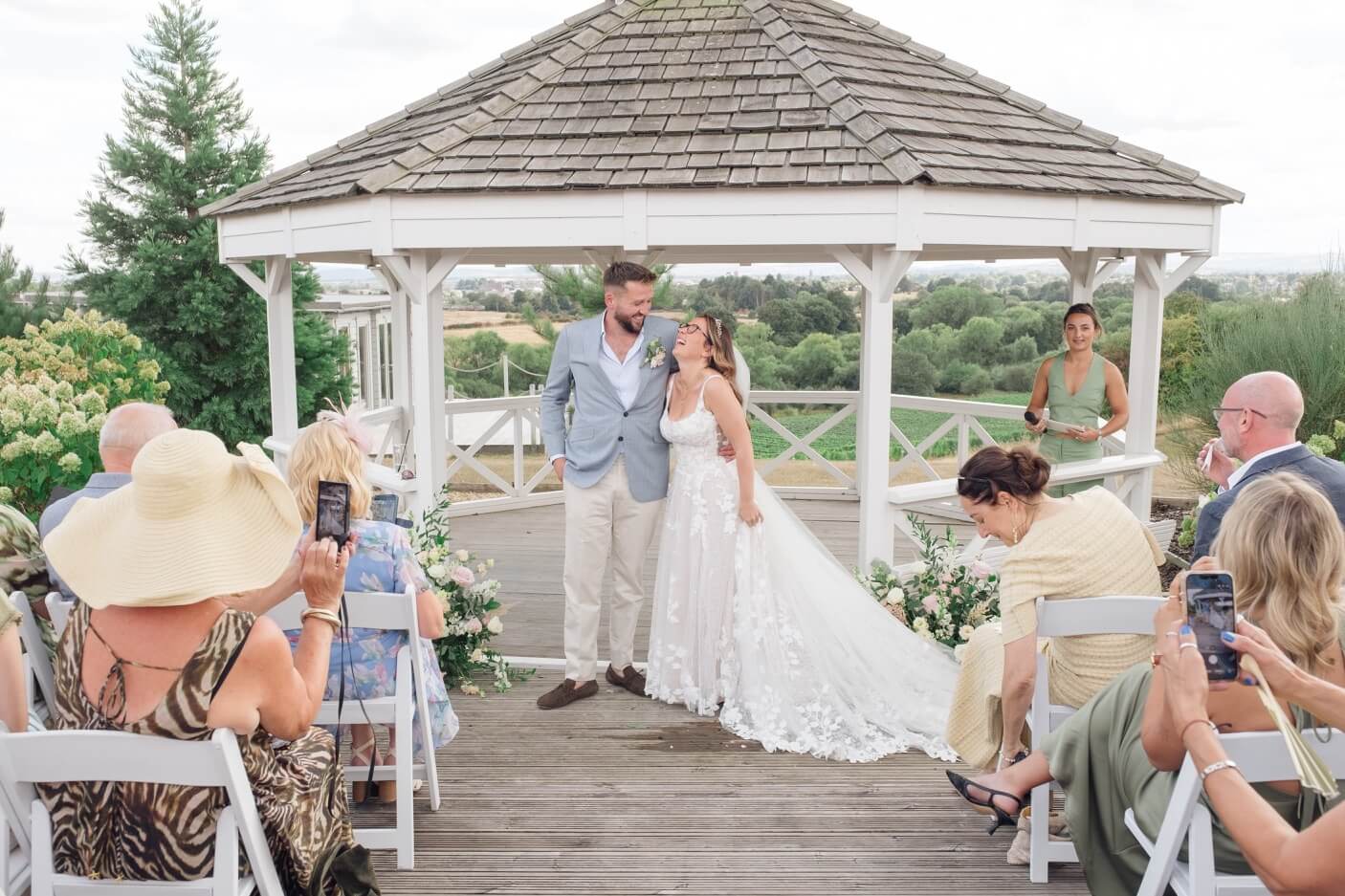 The bride and groom laughing during the ceremony