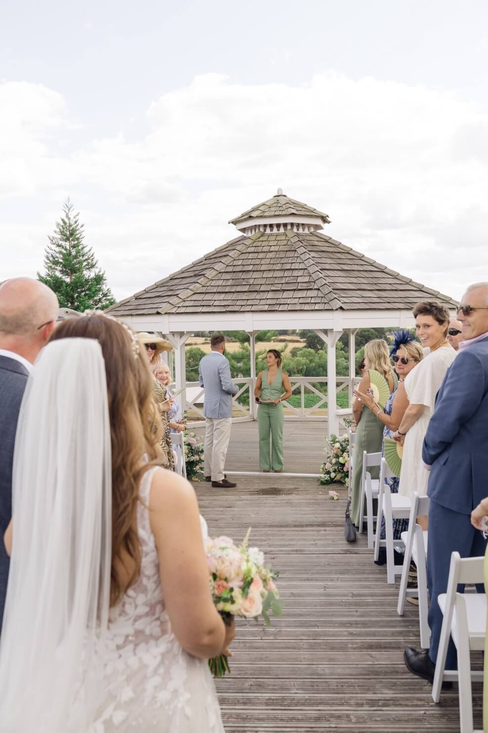 The bride and her father at the top of the aisle