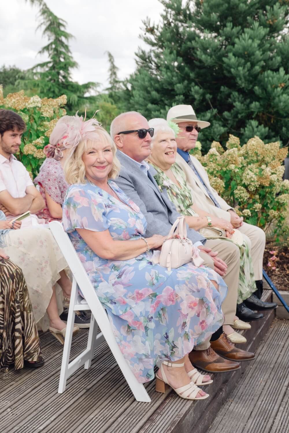 The grandparents seated before the ceremony