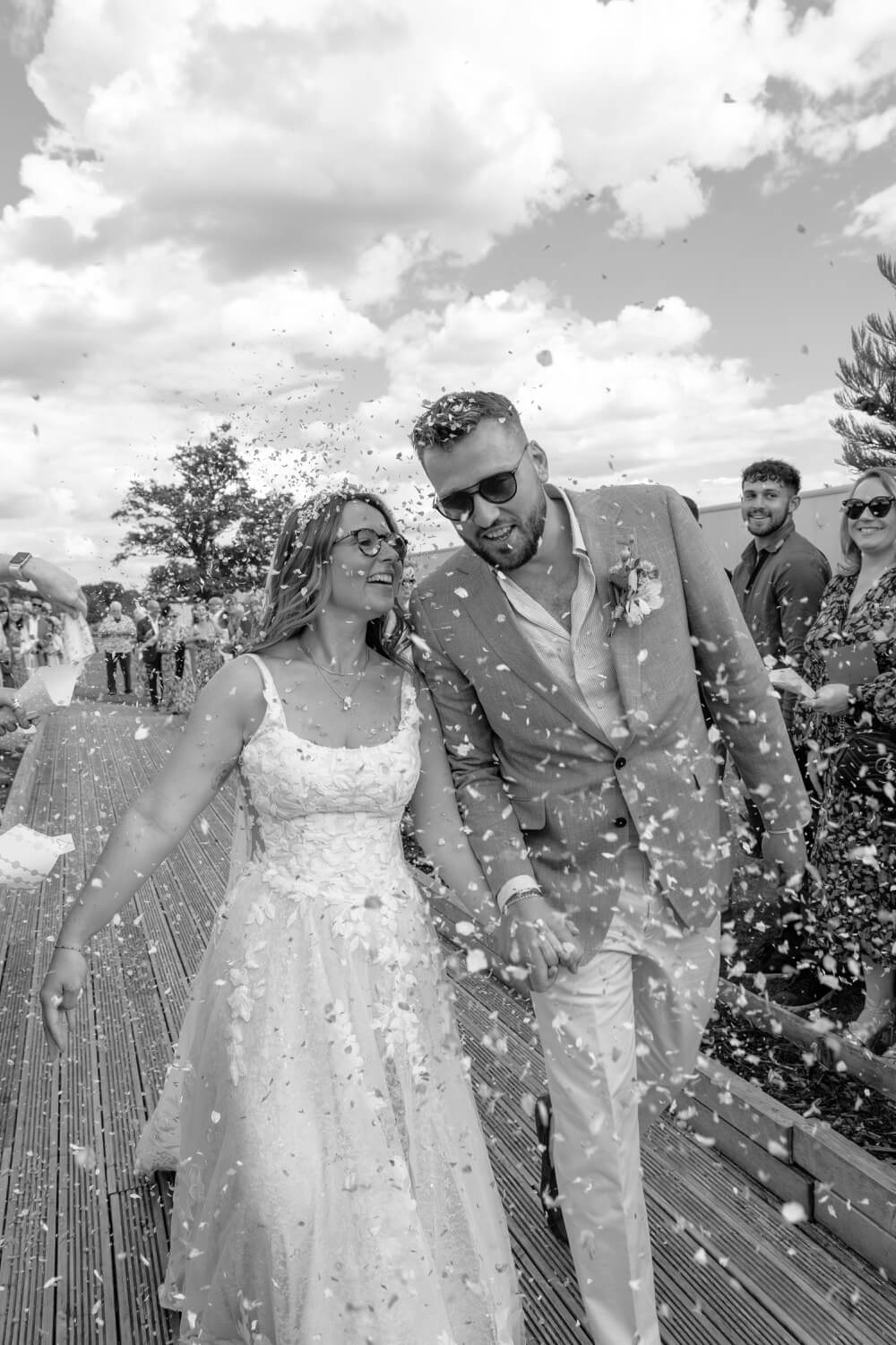 The bride and groom in the confetti