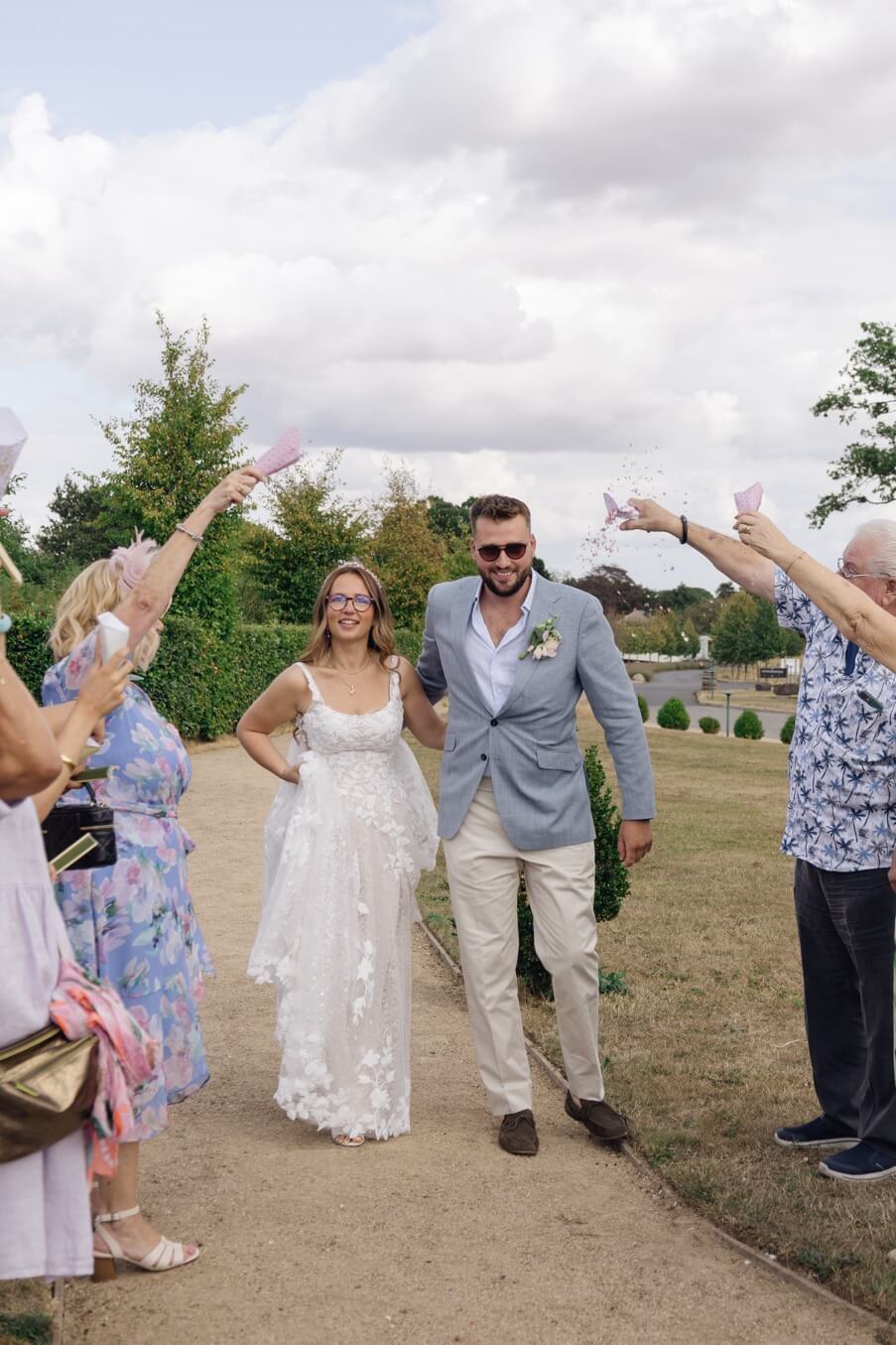 The start of the confetti as the couple walk through