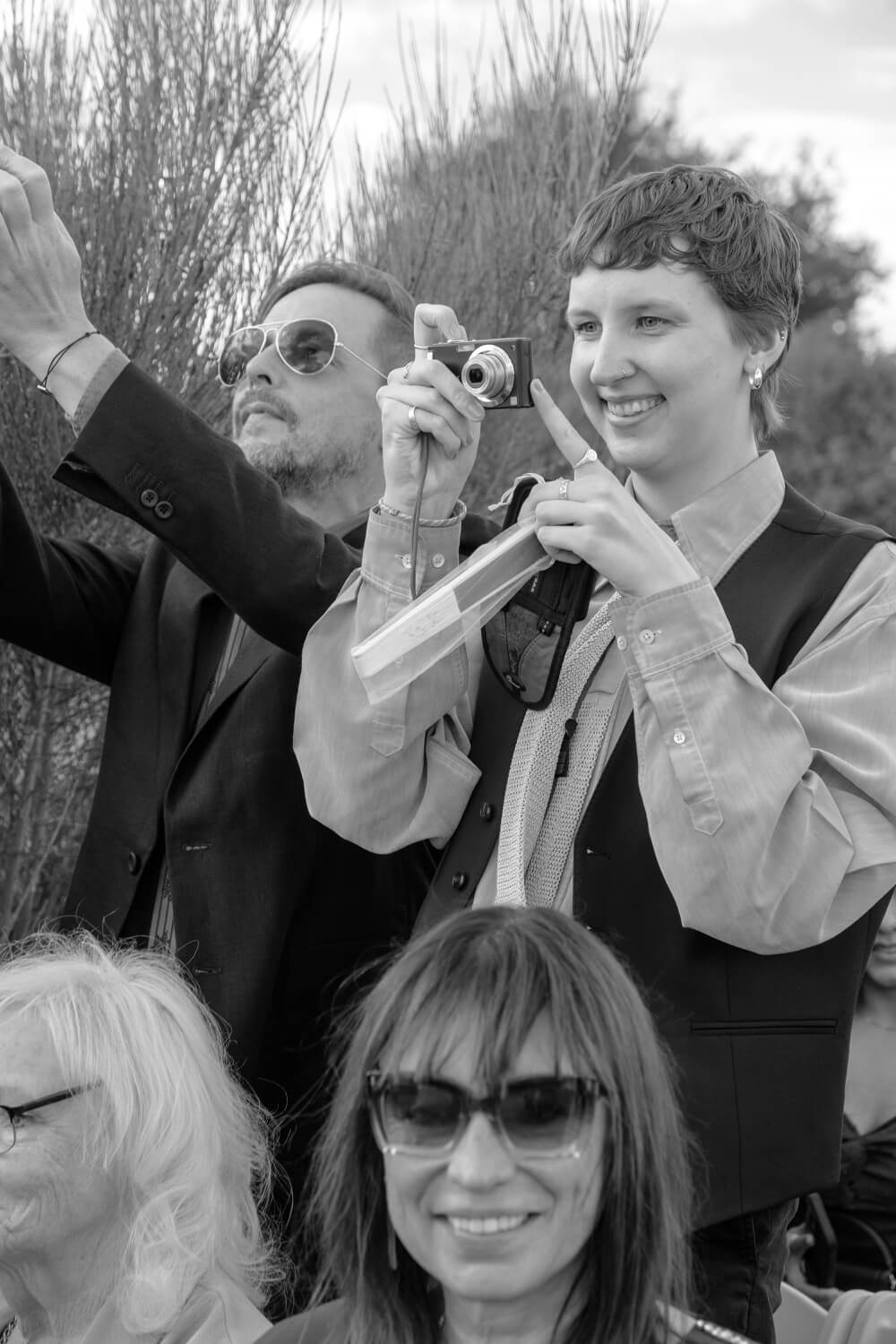 A guest taking a photo during the ceremony