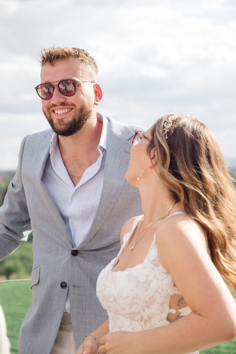 The groom in sunglasses on the terrace