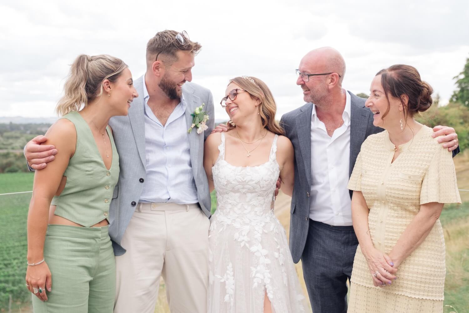 The bride and groom with the bride's sister, mum and dad